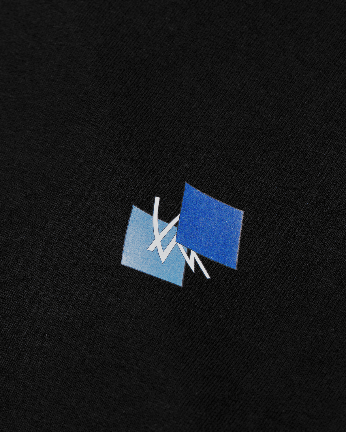 Alan Walker Blueprint T-Shirt chest print close-up, blue gradient panels behind a white AW logo mark