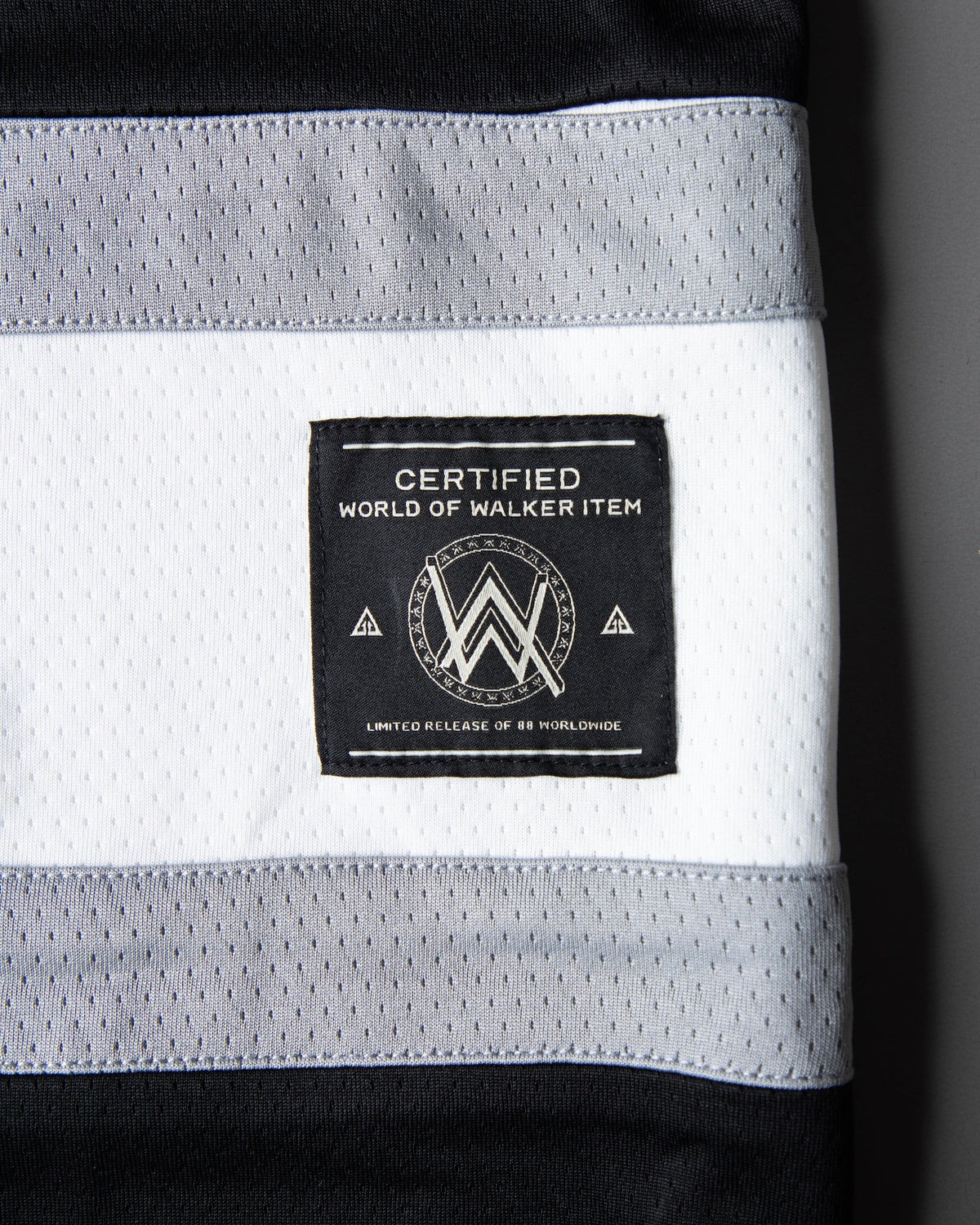 Alan Walker 0 Hockey Jersey hem stripe detail with the woven World of Walker label in black