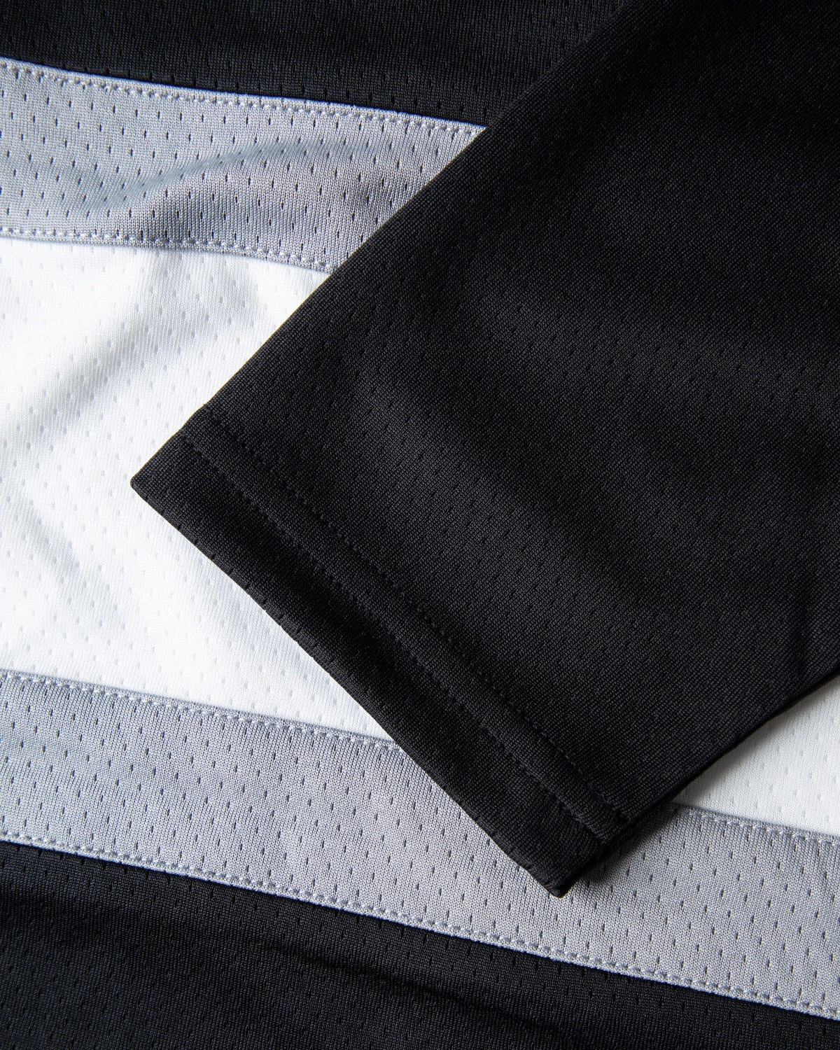 Alan Walker 0 Hockey Jersey long sleeve cuff detail laid over the grey and white body stripes