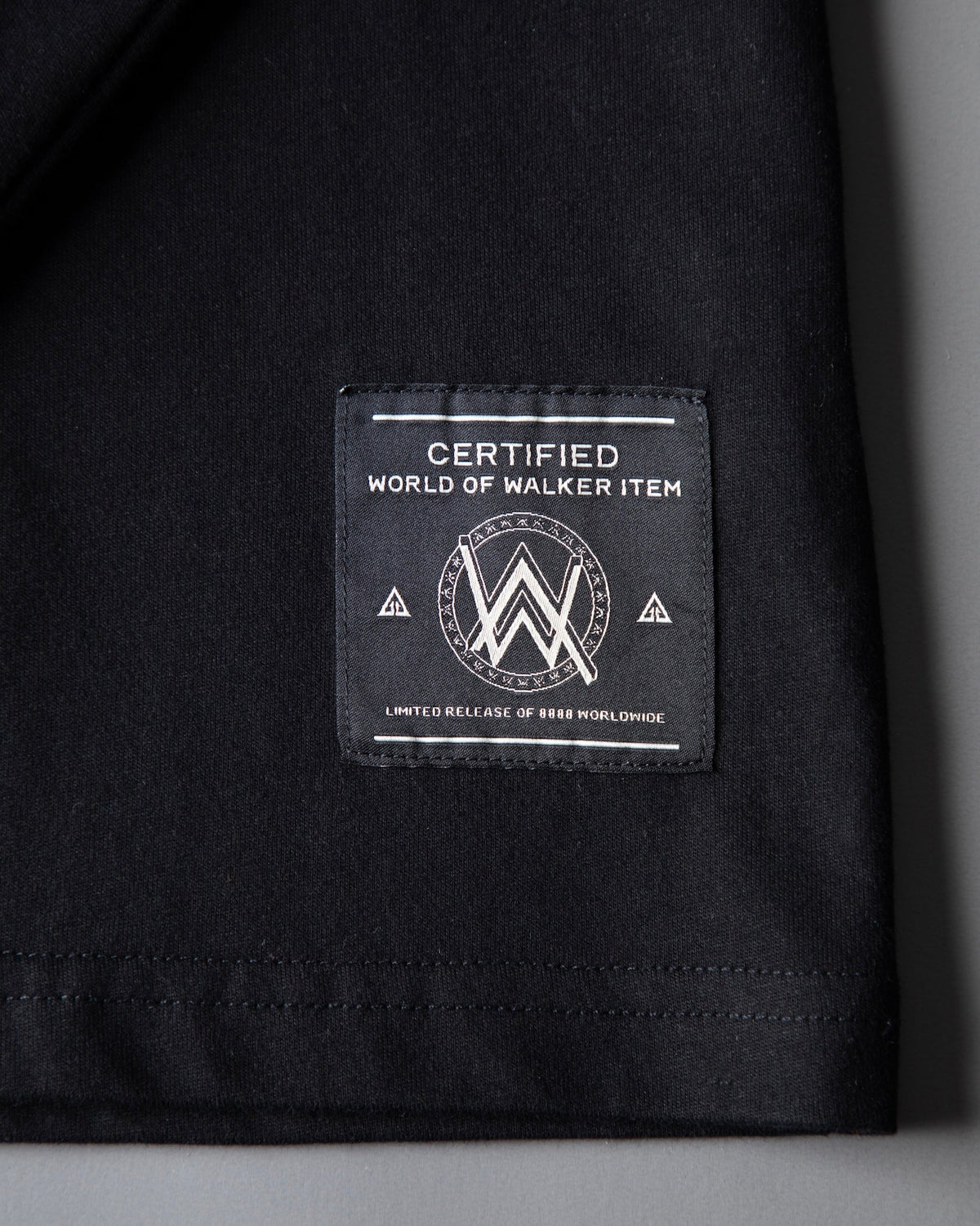 Alan Walker Monster Core Longsleeve hem detail with the woven World of Walker label on black cotton