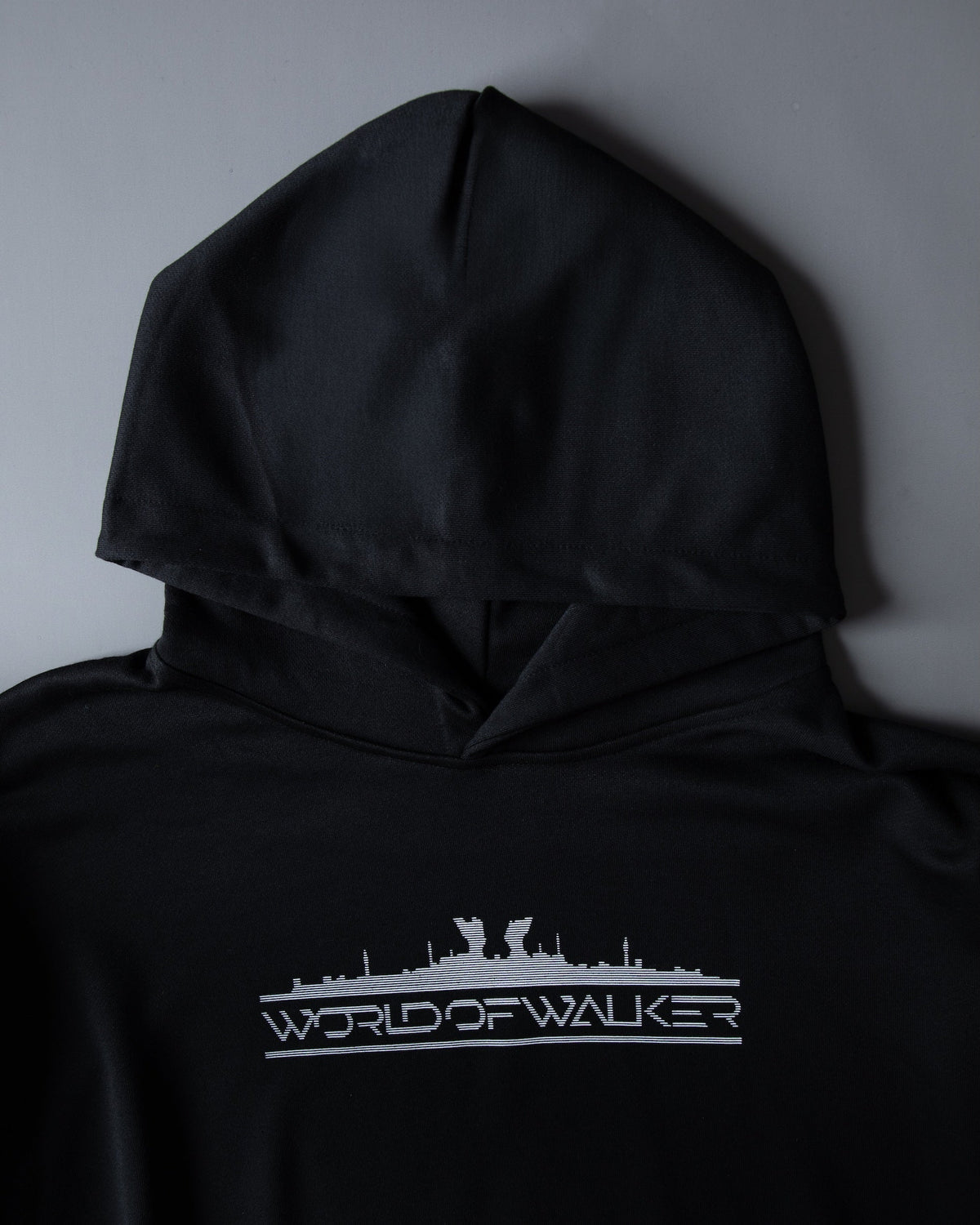 Alan Walker World of Walker Skyline Hoodie hood and chest detail, white skyline logo print on black cotton