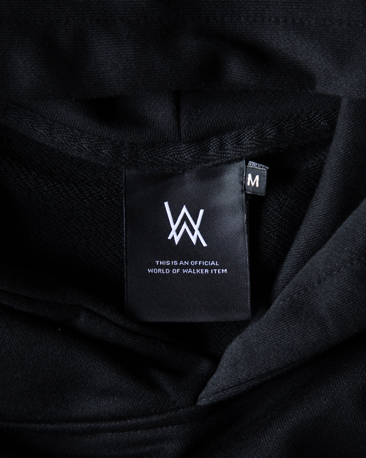 Alan Walker World of Walker Skyline Hoodie inner neck label reading This is an World of Walker brand label