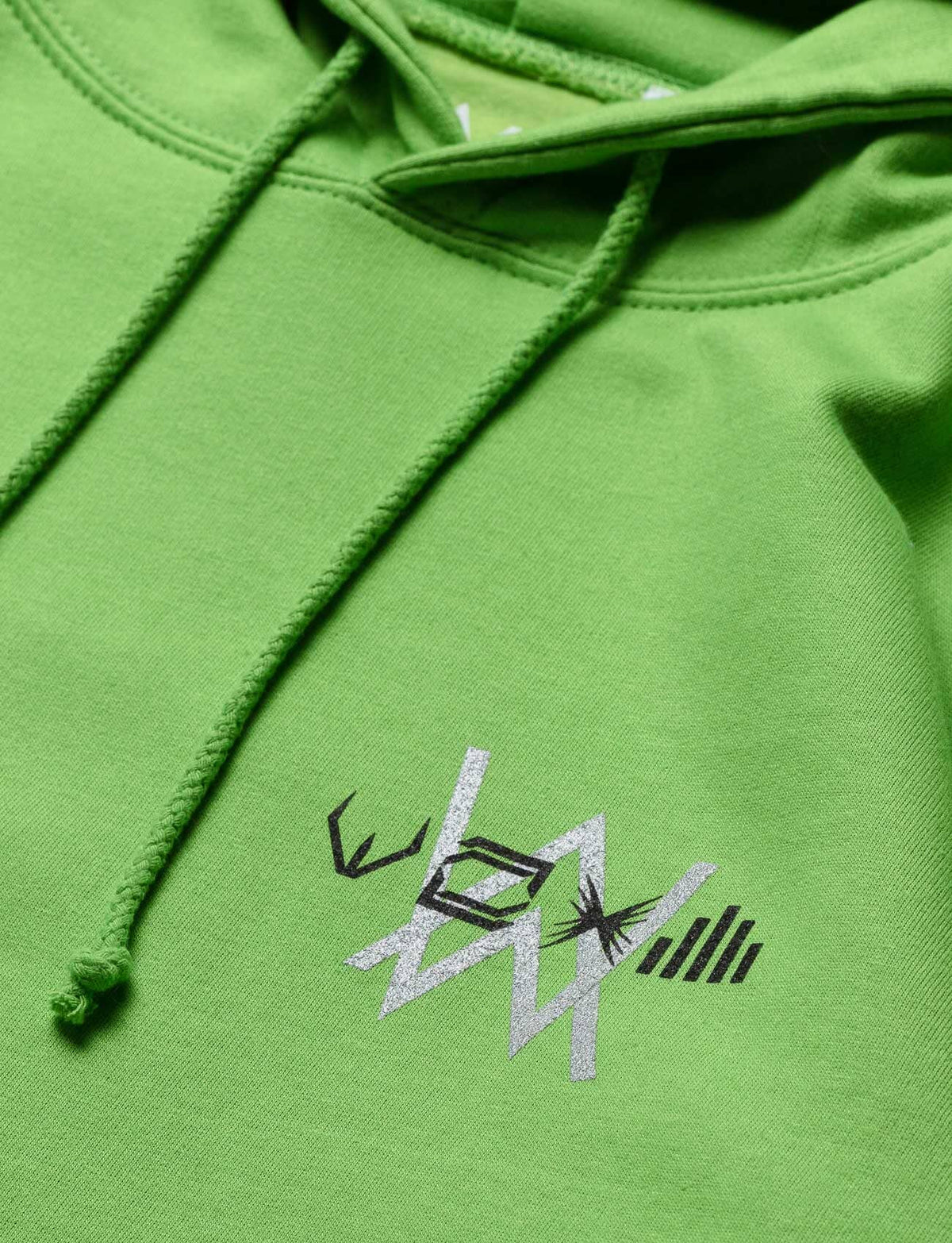 Alan Walker Stage Hoodie green chest print close-up, silver Walker graphic beside the hood drawcords