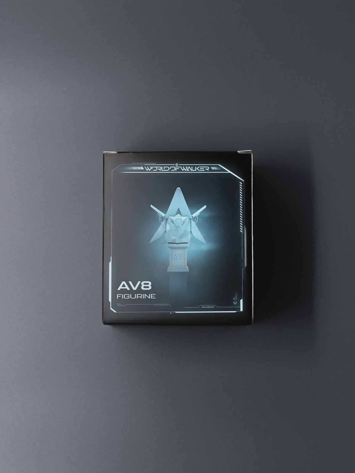 Alan Walker AV8 Figurine box front, black packaging with glowing blue artwork of the winged AW statue