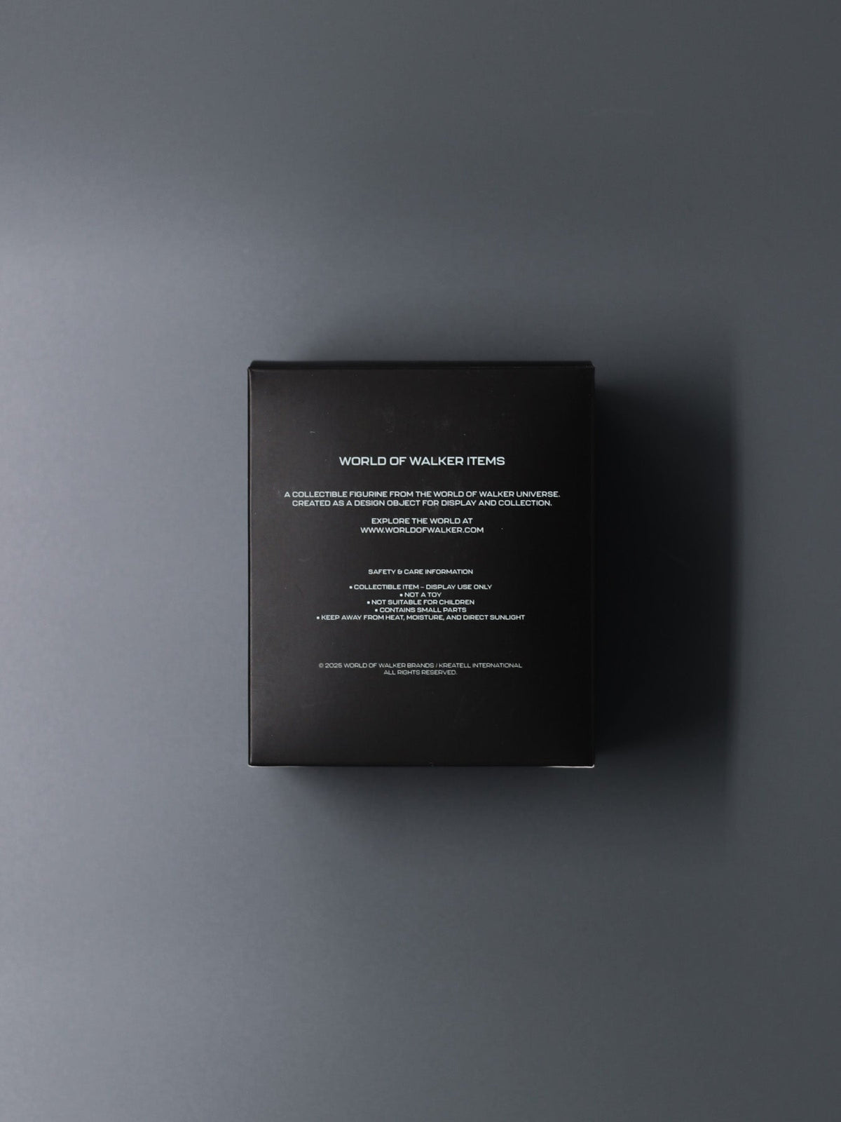 Alan Walker AV8 Figurine packaging back, matte black collector box printed with World of Walker text
