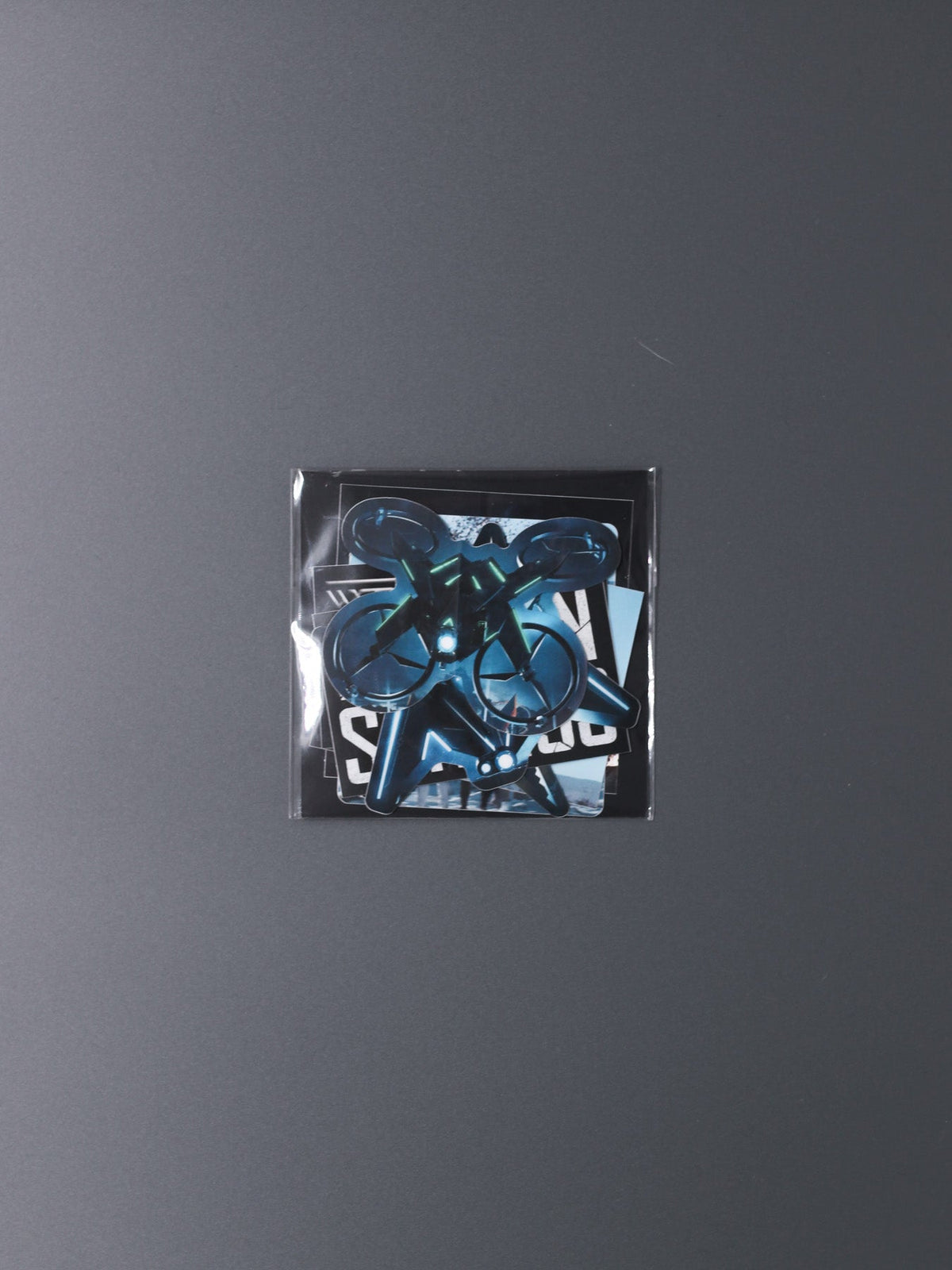 Alan Walker Rise of the Drones Sticker Pack sealed in its clear sleeve, blue drone artwork visible inside