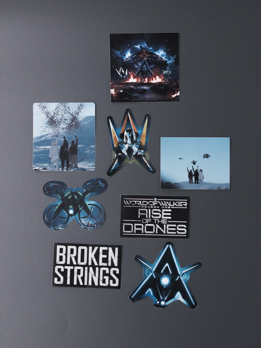 Alan Walker Rise of the Drones Sticker Pack laid out, drone, logo and Broken Strings decals on a dark surface