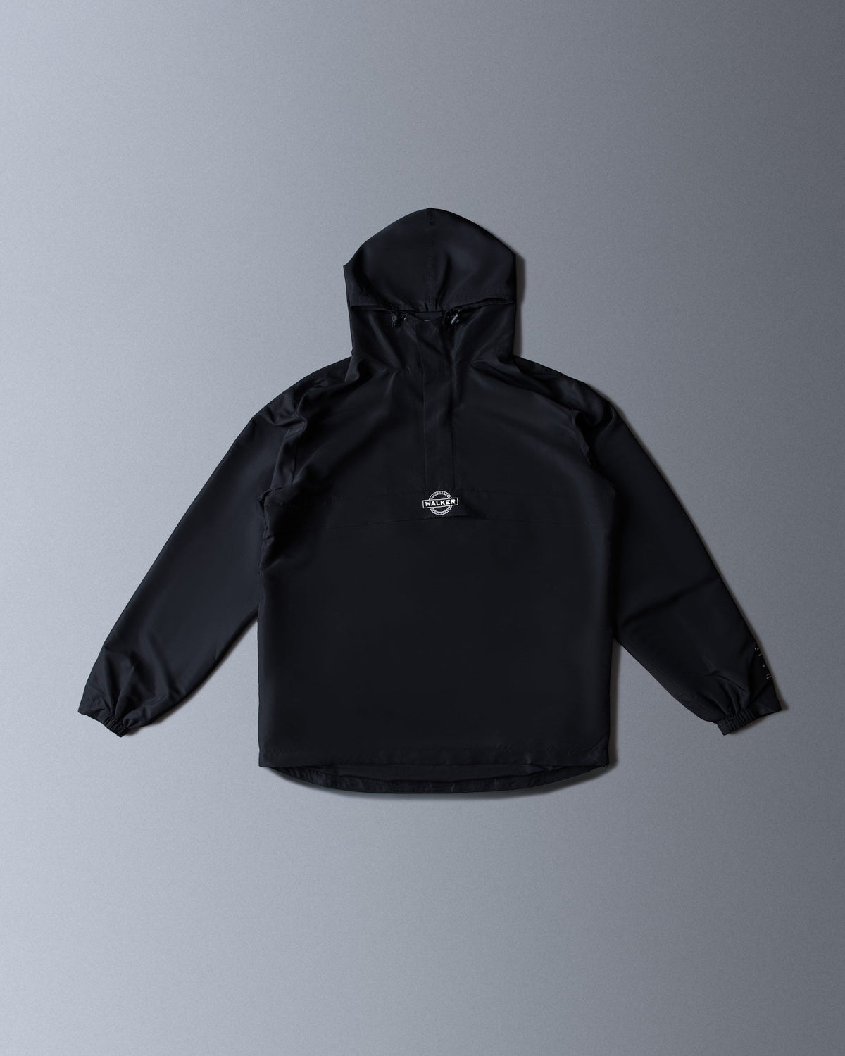 Alan Walker Core LV1 Windbreaker front flat lay, lightweight black hooded jacket with a small chest logo