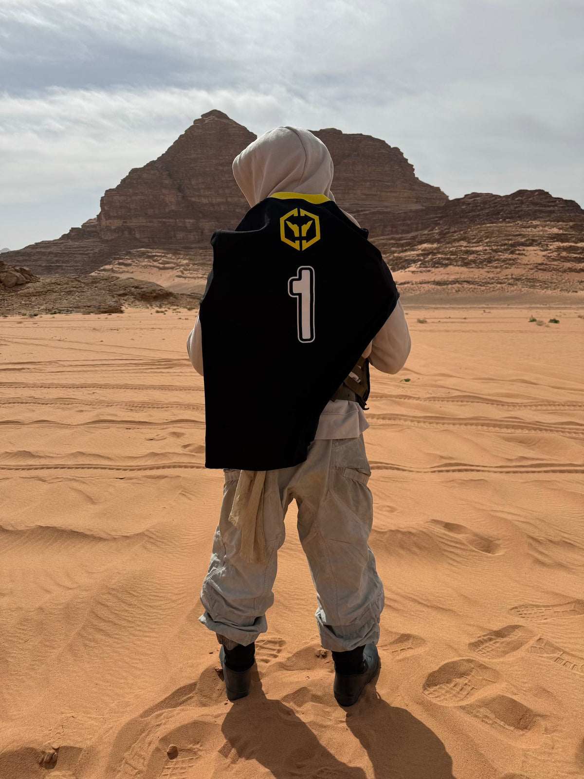 Alan Walker CheckPoint One Tribe Jersey worn over the shoulders in the desert, number 1 back print