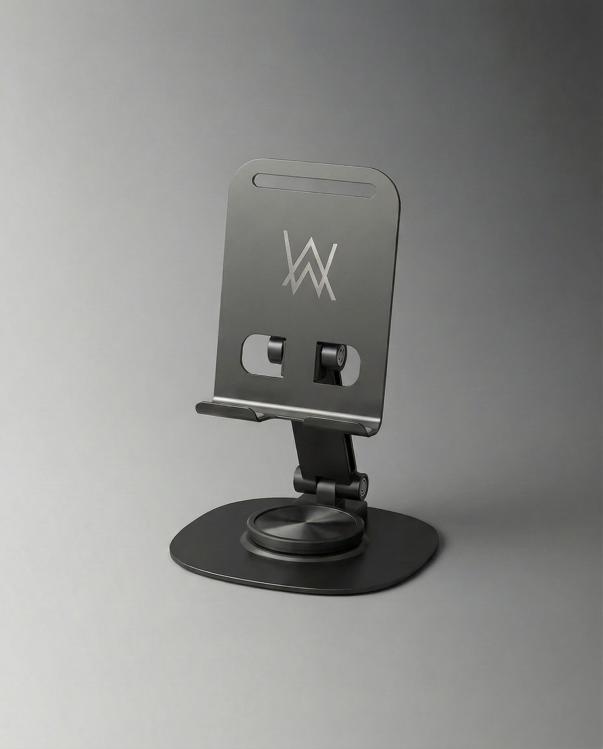 Alan Walker Logo Phone Stand in brushed grey metal, angled view of the folding stand with the white AW logo