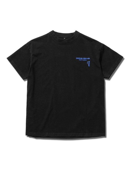 Alan Walker Drone Repair Shop T-Shirt front flat lay, black cotton tee with a small blue chest logo print