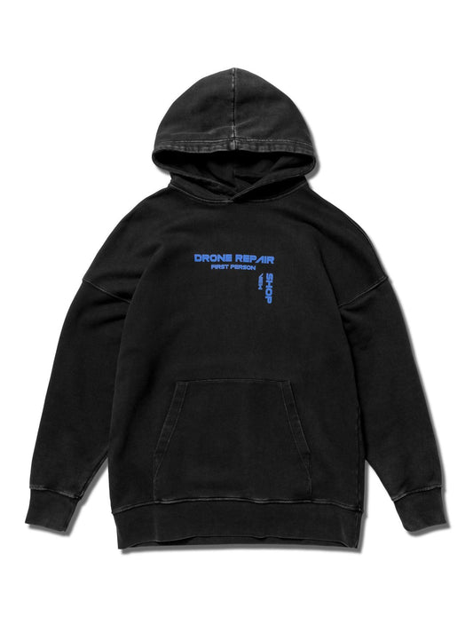 Alan Walker Drone Repair Shop Hoodie front flat lay, washed black pullover with a small blue chest print