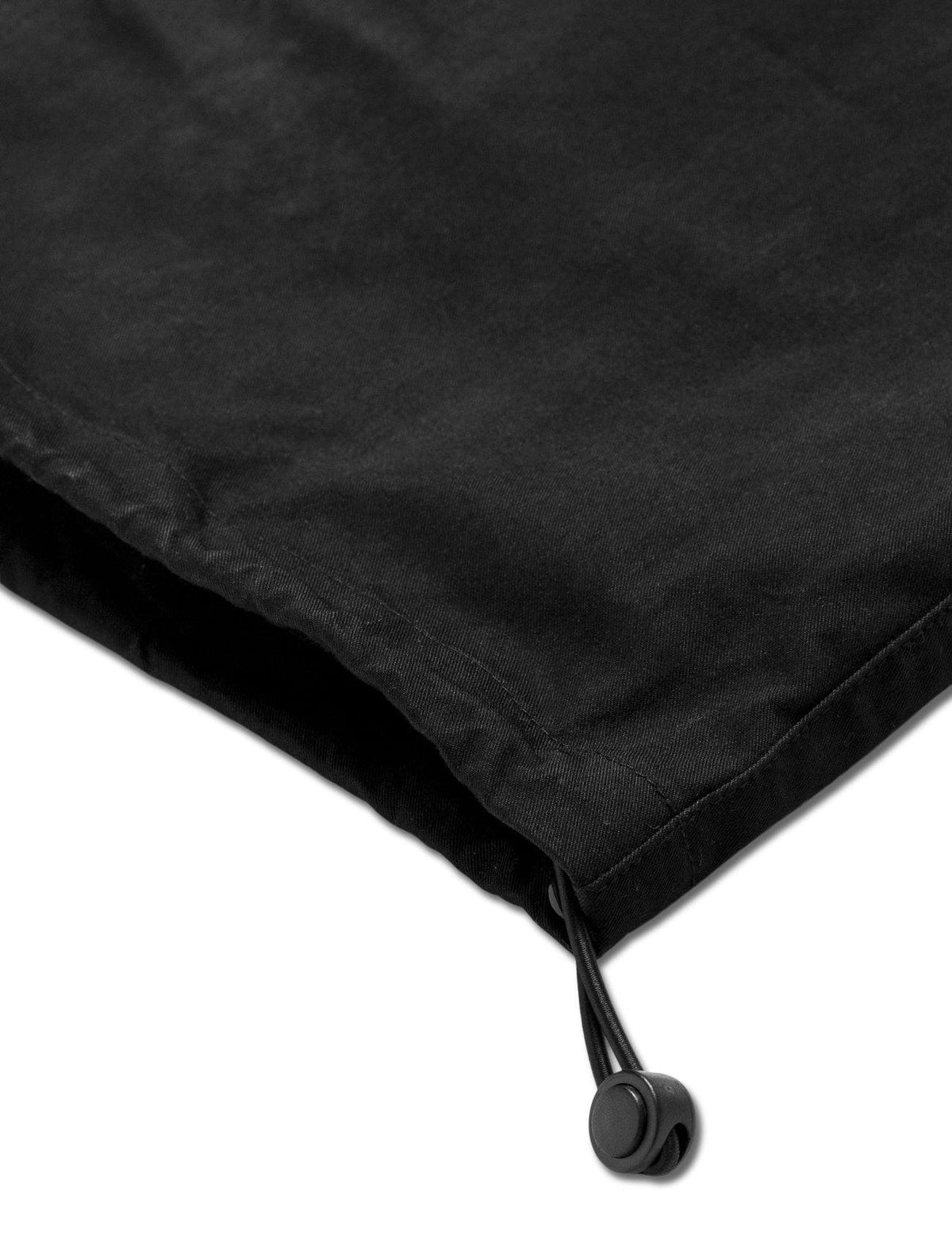Alan Walker Drone Repair Shop Cargo Pants hem close-up showing the elasticated cuff and black cord toggle