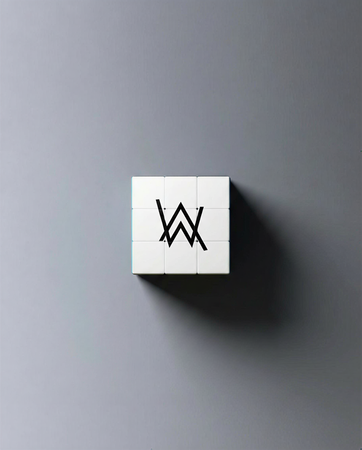 Alan Walker World of Walker Logo Cube collectible, white puzzle cube face showing the black AW logo