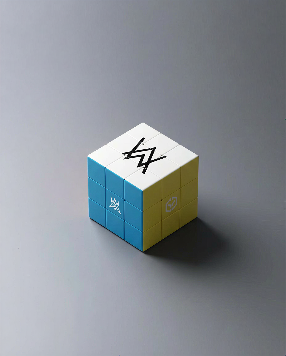 Alan Walker World of Walker Logo Cube angled view with white, blue and yellow faces carrying Walker symbols
