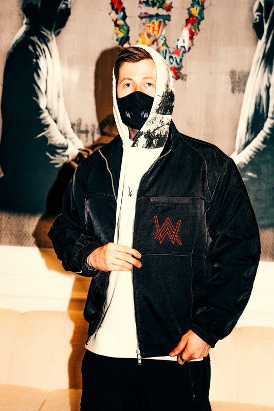 Alan Walker Legendary Sandstone Jacket worn open by a masked model, black bomber with red AW chest logo