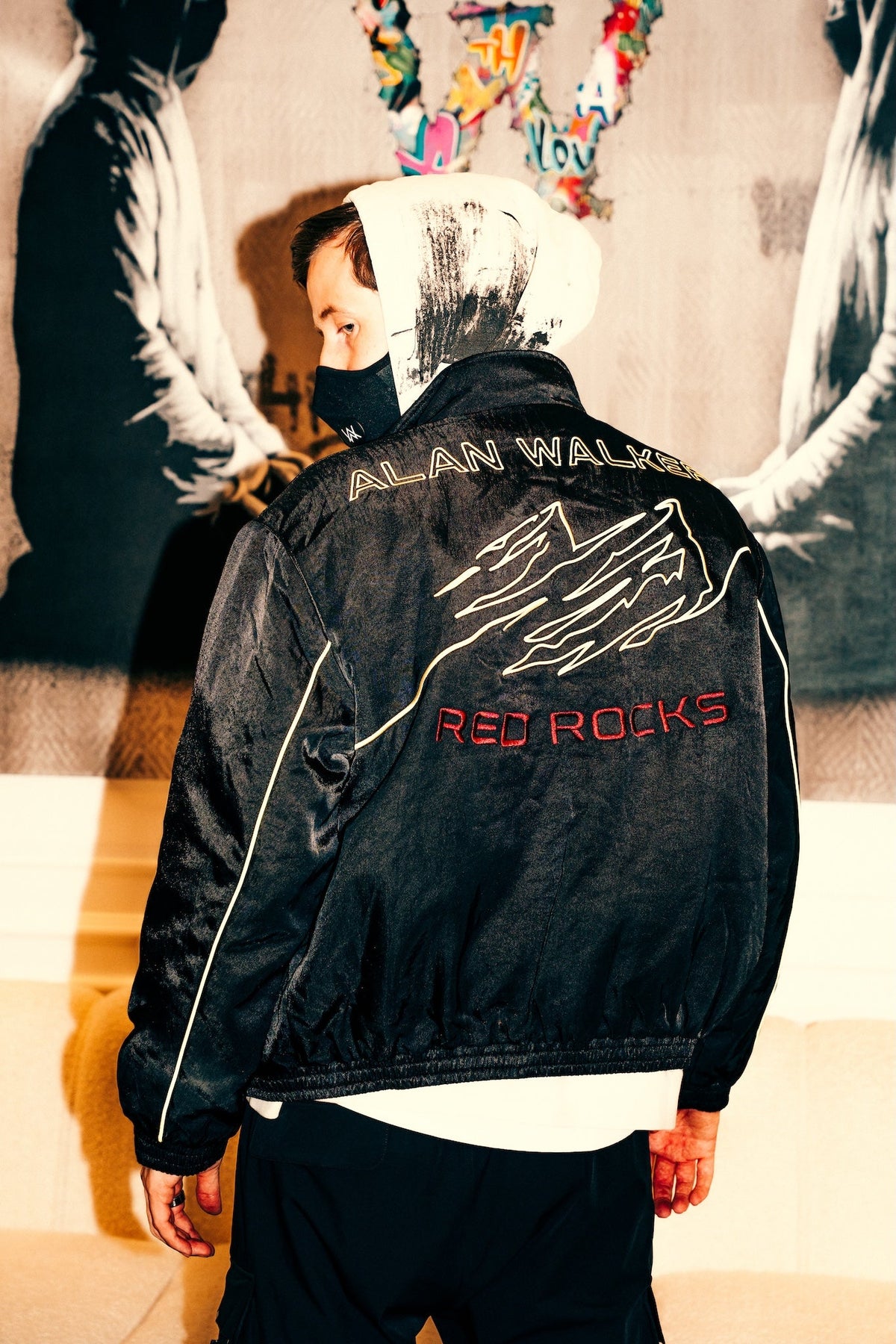 Alan Walker Legendary Sandstone Jacket back view on a model, embroidered Red Rocks artwork across the shoulders