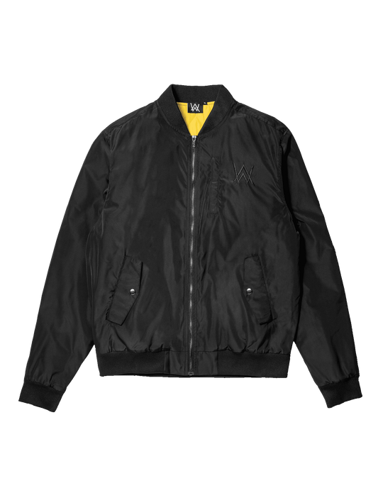 Alan Walker Walkerverse Bomber Jacket front flat lay in black with yellow inner collar and zip pockets