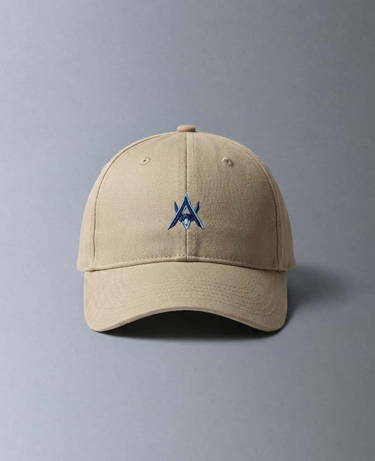 Alan Walker AV8 Cap front view, sand coloured baseball cap with a navy embroidered AW logo on the crown